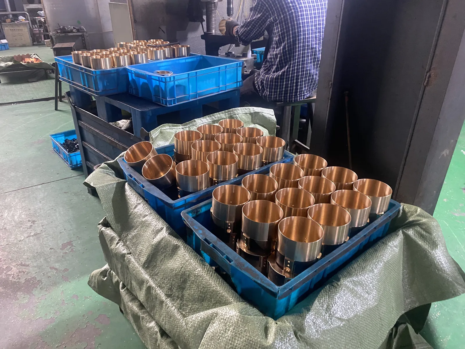 Copper contact sleeves prepared beside a machining station